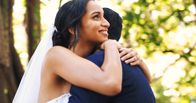 Wedding, couple and smile with hug at park for marriage ceremony, celebration and love commitment. Happy people, bride and groom with embrace at outdoor event for relationship union, bonding or bokeh - Powered by Adobe