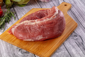 Raw pork sirloing over board