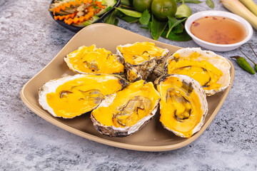 Baked oyster with cheddar cheese
