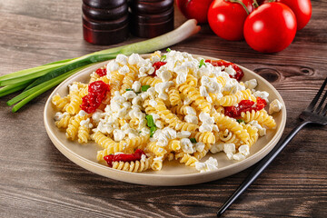 Italian pasta fusili with curd