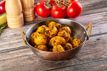 Baked small baby potato with herbs