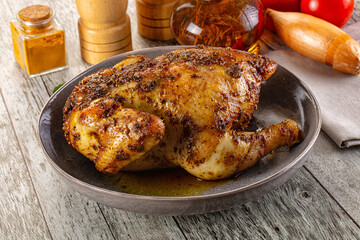 Baked in oven whole chicken with spices