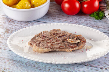 Grilled lamb steak with bone