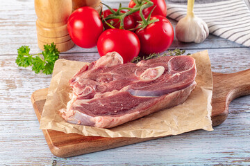 Raw lamb steak with bone
