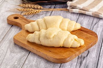 Raw uncooked croissant for bake