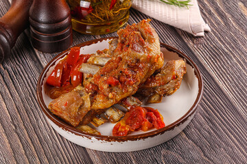 Baked lamb ribs with vegetables