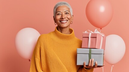 A smiling woman holds two beautifully wrapped gifts, surrounded by soft pink balloons. The scene radiates happiness, perfect for a festive birthday celebration