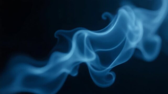 Video A close-up shot of blue smoke on a black background, perfect for representing mystery or drama in various contexts