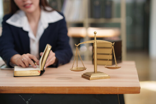 Business woman lawyer working on legal matters in a law office	