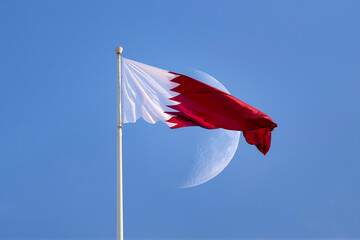 Doha, Qatar- December 10, 2025: Qatar Flag flying high in the wind. National Museum Qatar 