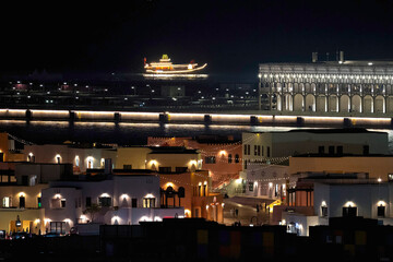 Doha, Qatar - December 10, 2025: Night view of Old Doha port redevelopment into Mina district Box Park Qatar