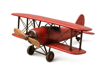 Red biplane toy model bringing vintage aviation and travel concepts, featuring propeller and wings on a transparent background