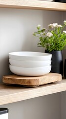 Fototapeta premium Stacked White Bowls on Rustic Wooden Slab, Modern Kitchen Shelf Styling