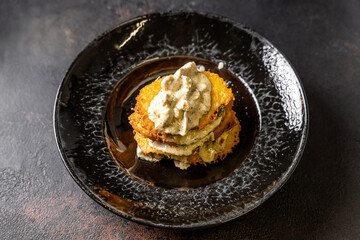 Golden Potato Fritters With Creamy Sauce Stack