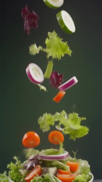 slow-motion fresh salad ingredients falling into bowl, vibrant colors, clean studio lighting, healthy food commercial.&rdquo;