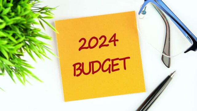 The concept phrase 2024 BUDGET appears on a yellow sticker. 2024 Budget planning and allocation concept
