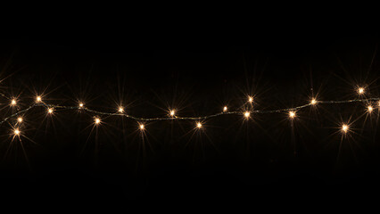 Festive Holiday Lights: Glowing and Twinkling String Illumination for Cheerful Night Celebration Background