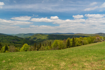 Partly cloudy day in springtime Beskid Slaski mountains in Poland