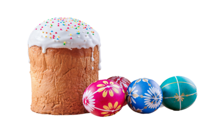 A festive composition featuring a tall Easter cake with white dripping glaze and colorful sprinkles, accompanied by three brightly painted eggs (pink, blue, and teal) with floral and geometric pattern