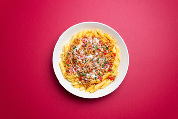 Pasta with bolognese sauce and cheese. Italian cuisine. Traditional recipe.