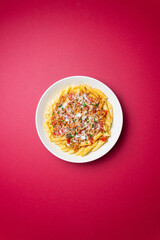 Pasta with bolognese sauce and cheese. Italian cuisine. Traditional recipe.