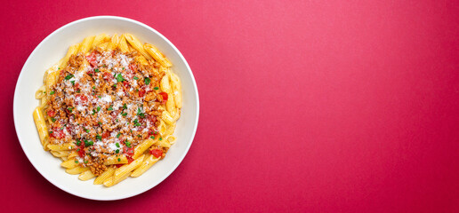 Pasta with bolognese sauce and cheese. Italian cuisine. Traditional recipe.