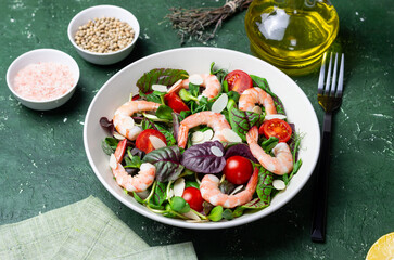 Salad with shrimp, cherry tomato, and almond. Healthy eating. Diet.