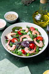 Salad with shrimp, cherry tomato, and almond. Healthy eating. Diet.