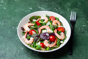 Salad with shrimp, cherry tomato, and almond. Healthy eating. Diet.