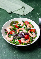Salad with shrimp, cherry tomato, and almond. Healthy eating. Diet.
