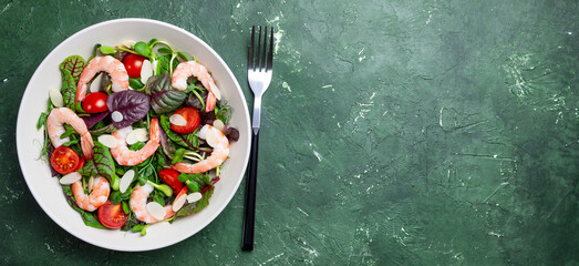 Salad with shrimp, cherry tomato, and almond. Healthy eating. Diet.