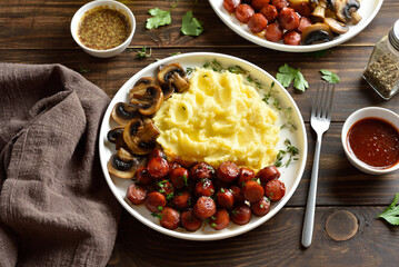Mashed potatoes with roasted sweet and spicy sausage bites and mushrooms