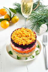 Christmas layered vegetable salad with herring and boiled vegetables