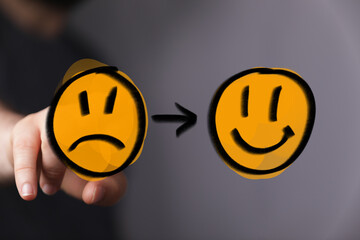 Digital representation of changing emotions from sad to happy, symbolizing mental health progress, personal growth, and finding solutions for we