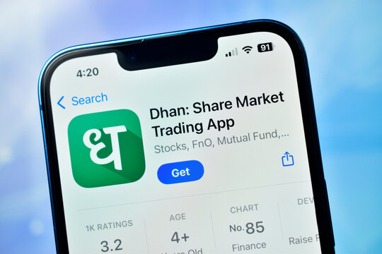 New Delhi, India 11 December :- Dhan Share Market Trading App Store Page on Smartphone Screen