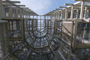 Metal building architecture of Bird Watch Tower against blue sky