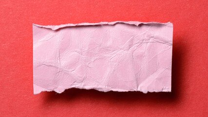 Obraz premium One single pink torn ripped wrinkled crumpled blank paper note with drop shadow, folded edge and copy space for text on background