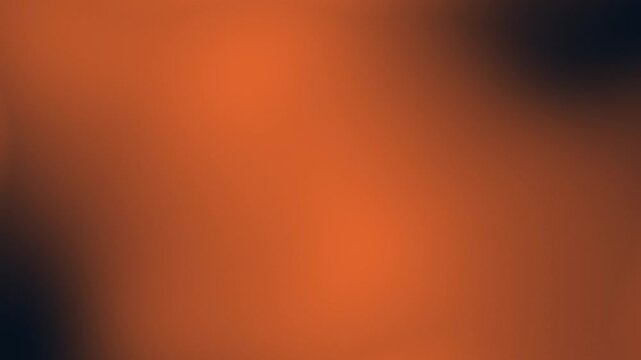 A stunning, seamless loop of a warm, vibrant orange gradient blending smoothly into a deep, dark black. This cinematic, blurred abstract motion background is perfect for modern designs, presentations