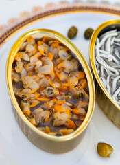 Cans of preserves with elvers and cockles