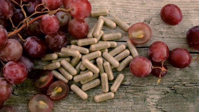 Grape seed extract in the garden. Selective focus.
