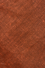 A close up shot of a dark brown woven fabric with a fine mesh pattern displayed at a diagonal angle