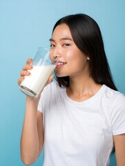Smiling Woman Drinking Glass of Milk - Healthy Lifestyle Portrait