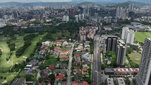 sunny day kuala lumpur city golf course residential living area traffic road aerial panorama 4k malaysia 