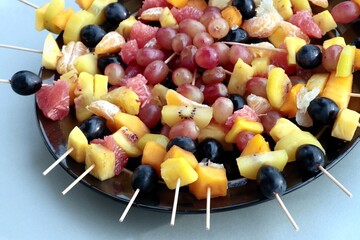 composition of cut various fruits close up dish