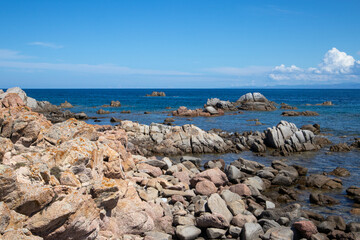 Rocks and water on the beach of San Silverio, Sardinia, Italy.