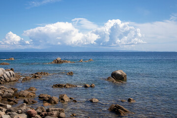 Rocks and water on the beach of San Silverio, Sardinia, Italy.
