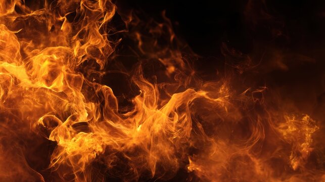 A close up of a fire with orange flames. The fire is very large and is surrounded by smoke. Scene is intense and dramatic