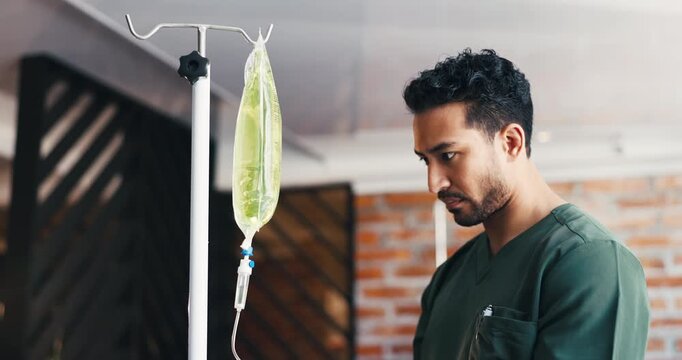 Telehealth, nurse or man with iv drip, wellness or vitamin b with detox, liquid or treatment. Medicine, medical service or person with electrolytes, supplements or antibiotics with fluid or hydration