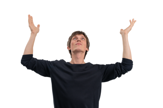 Young man raising both hands and looking upward with confident expression, isolated on white background, closeup concept for success or hope - Powered by Adobe
