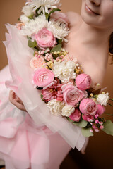 photo session of a girl in a bouquet of fresh flowers